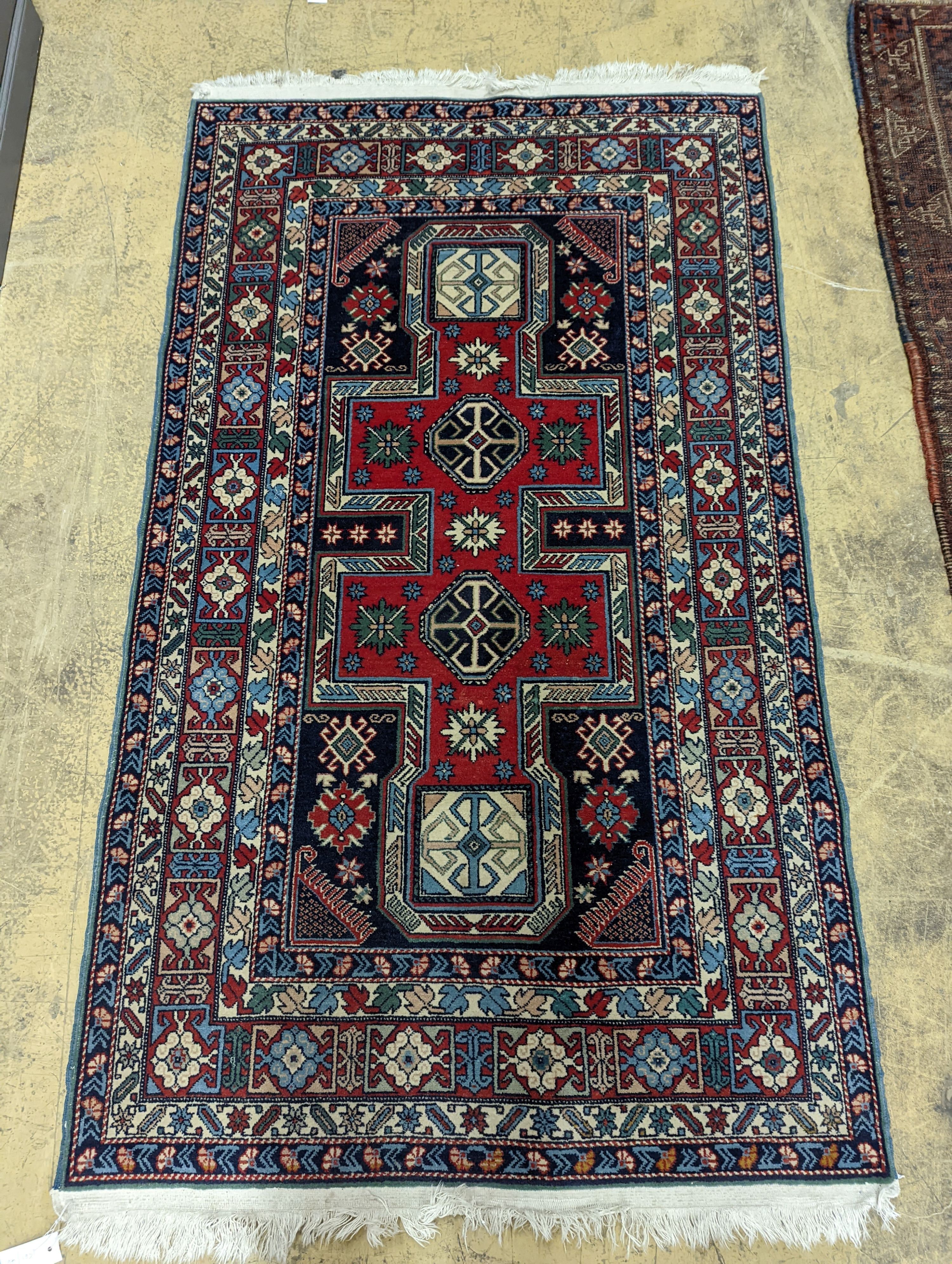 A Caucasian blue ground rug, 166 x 100cm